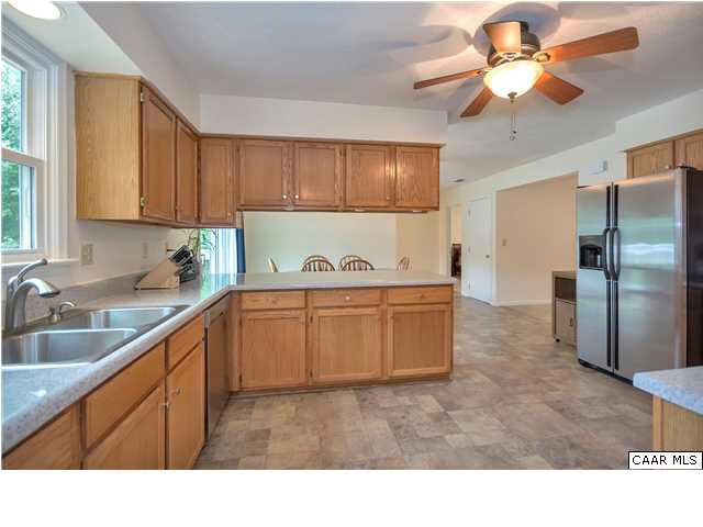 6 Spring Oaks Lane Ruckersville, VA 22968 - Photo 14 of 27 a kitchen with kitchen island granite countertop a sink cabinets and stainless steel appliances