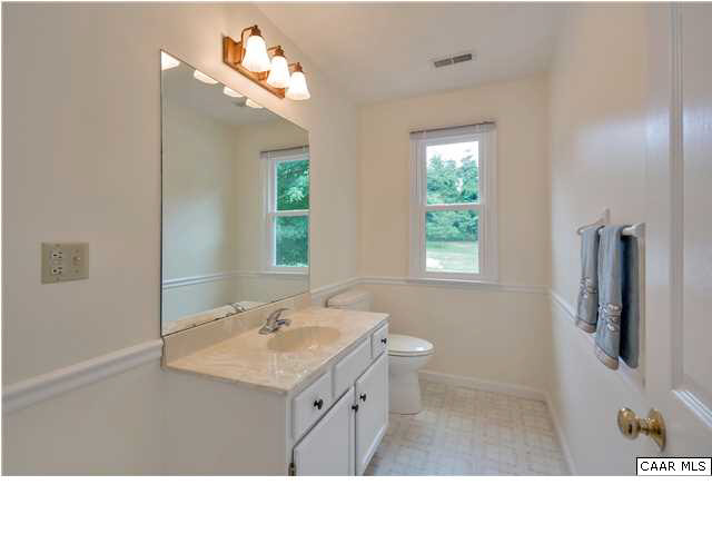 6 Spring Oaks Lane Ruckersville, VA 22968 - Photo 17 of 27 a bathroom with a sink vanity granite and a mirror