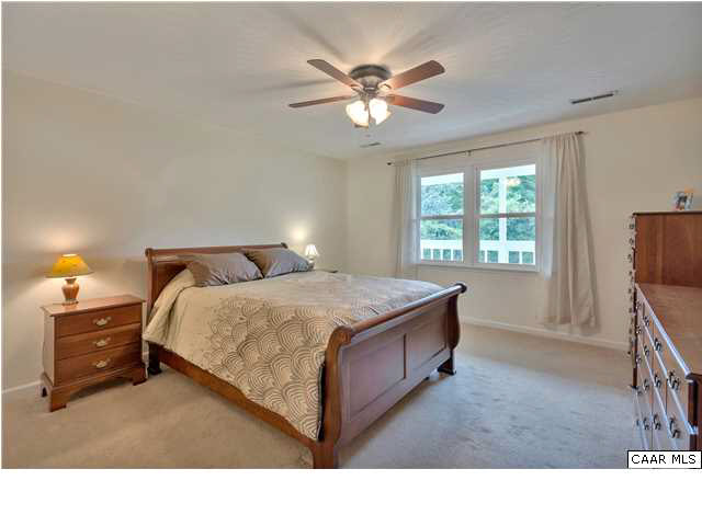 6 Spring Oaks Lane Ruckersville, VA 22968 - Photo 18 of 27 a living room with a bed furniture and a flat tv screen