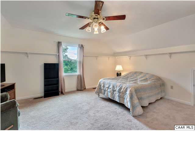 6 Spring Oaks Lane Ruckersville, VA 22968 - Photo 20 of 27 a bedroom with a bed and a ceiling fan