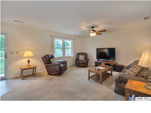 6 Spring Oaks Lane Ruckersville, VA 22968 - Photo 8 of 27 a living room with furniture and a flat screen tv