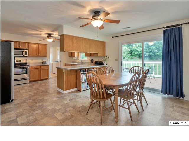 6 Spring Oaks Lane Ruckersville, VA 22968 - Photo 9 of 27 a view of a dining room with furniture and a chandelier
