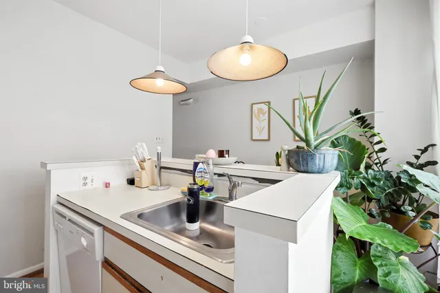 a kitchen with a sink and cabinets