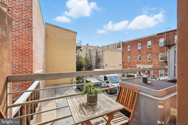 a view of balcony with a potted plants
