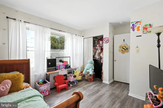 a bedroom with bed and a window