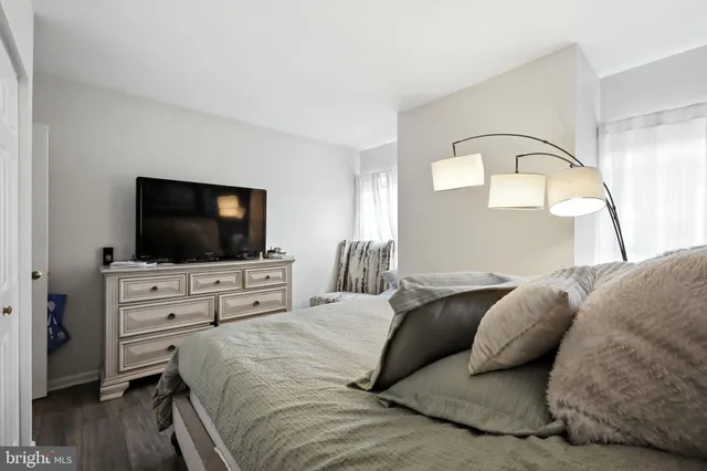a view of a hallway with paintings on the wall
