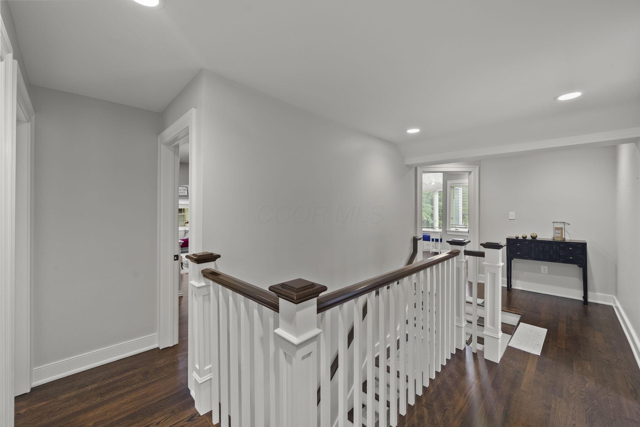 1851 Berkshire Road Columbus, OH 43221 - Photo 29 of 125 Second floor landing and hall, over looking the primary bedroom.