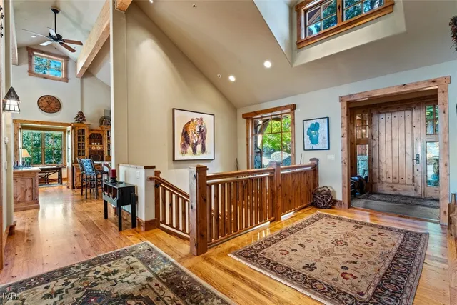 a living room with furniture rug and a table