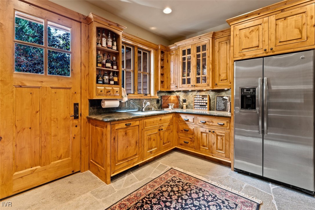 790 Fairview Boulevard Incline Village, NV 89451 - Photo 13 of 49 a kitchen with stainless steel appliances granite countertop a refrigerator a stove and a cabinets with wooden floor