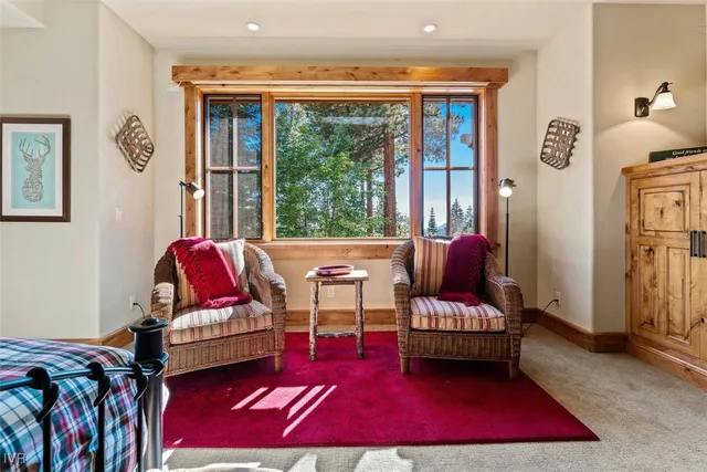 a spacious bathroom with double vanity and a mirror