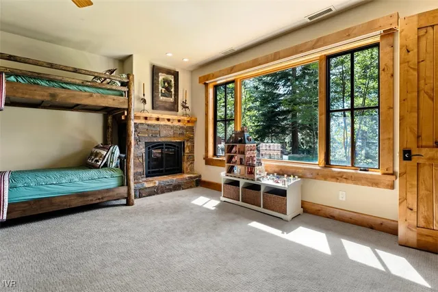 a bedroom with furniture and a fireplace