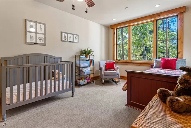a bathroom with a sink vanity mirror and toilet