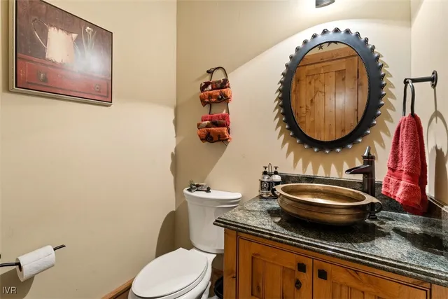 a living room with couch a dining table with rug floor