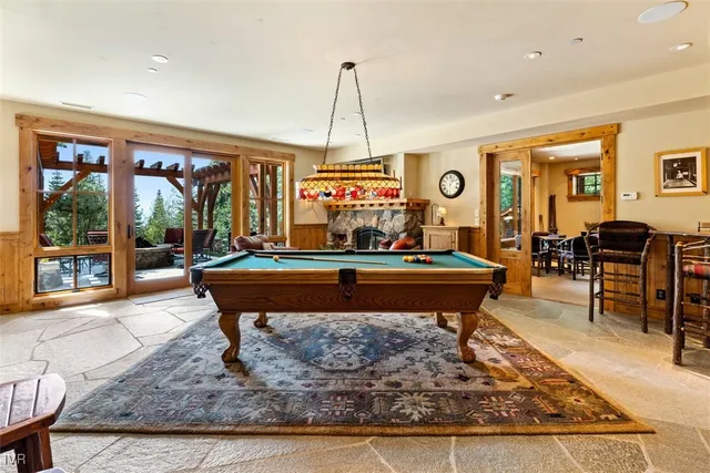 a living room with furniture flat screen tv and a fireplace