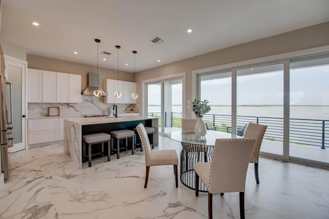 a view of a dining room with furniture window and outside view
