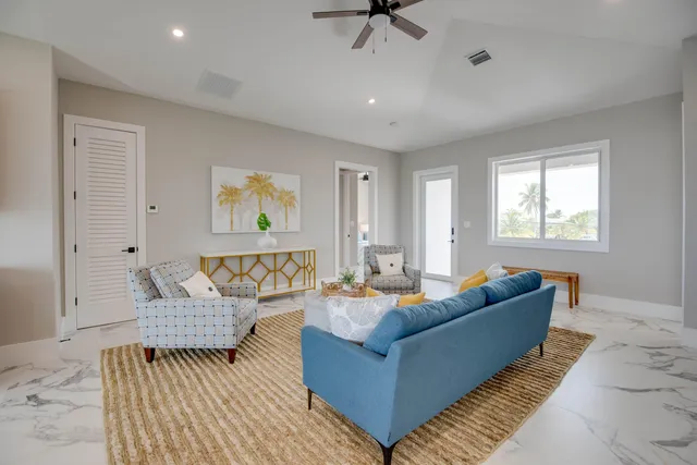a living room with furniture and a window