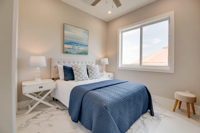 a bedroom with a bed and a chair