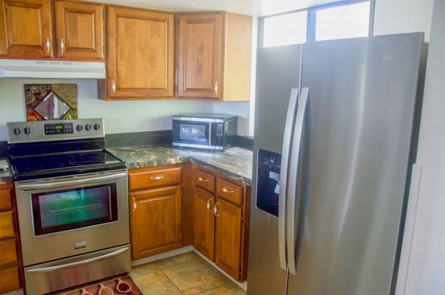 a view of a garden with a building in the background