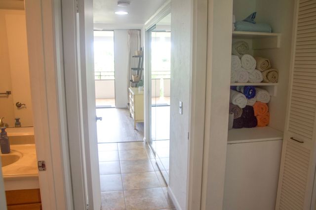 a bedroom with a bed window and a table