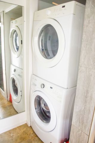 a white toilet sitting next to a bathroom sink