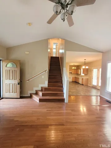 a view of entryway and hall with wooden floor