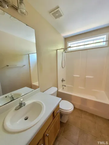 a bathroom with a white bath tub