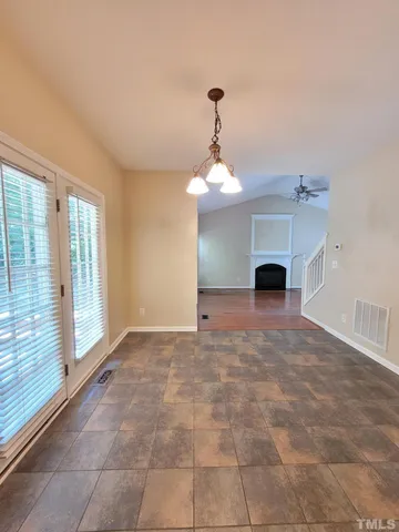 a large kitchen with a stove top oven sink and cabinets