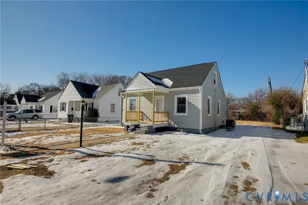 a view of a house with a snow in the background
