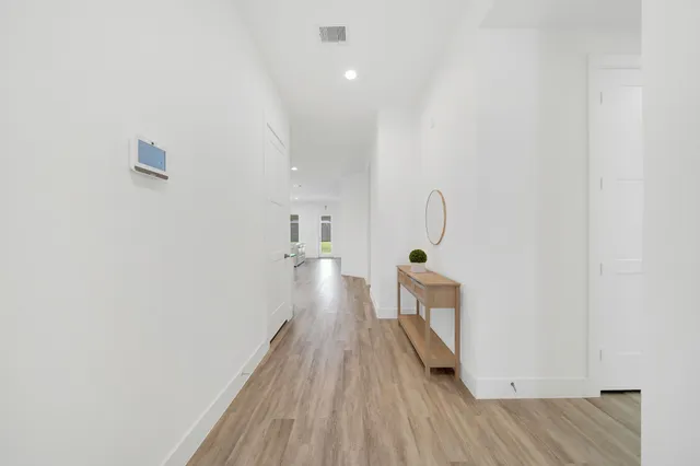 a view of a hardwood floor in a room