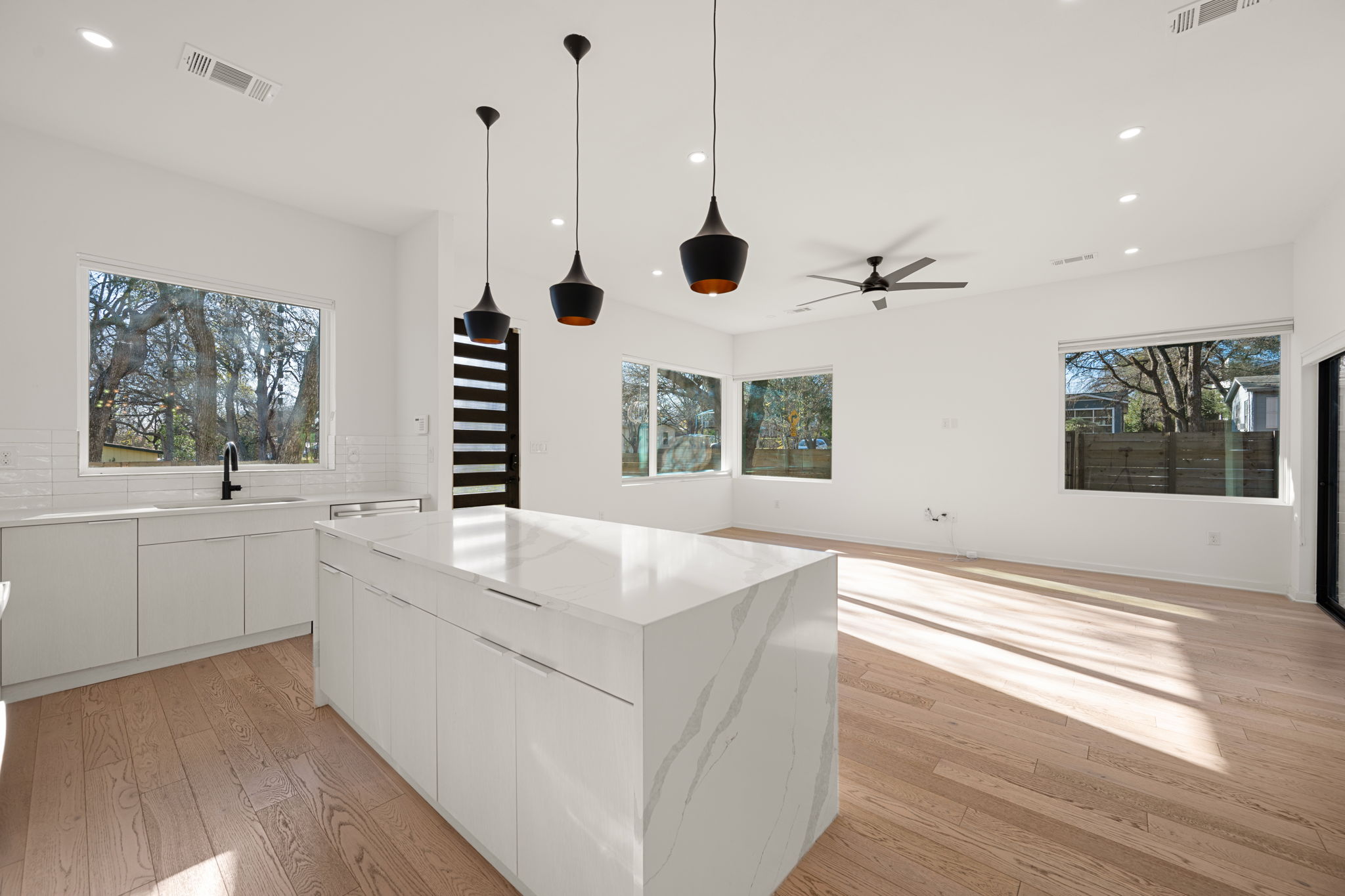 910 Nalide Street, Unit B Austin, TX 78745 - Photo 12 of 38 a large white kitchen with a large window