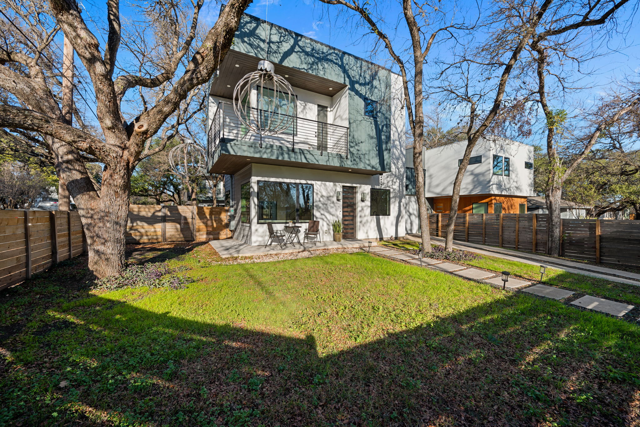910 Nalide Street, Unit B Austin, TX 78745 - Photo 36 of 38 a view of a swimming pool with plants and trees