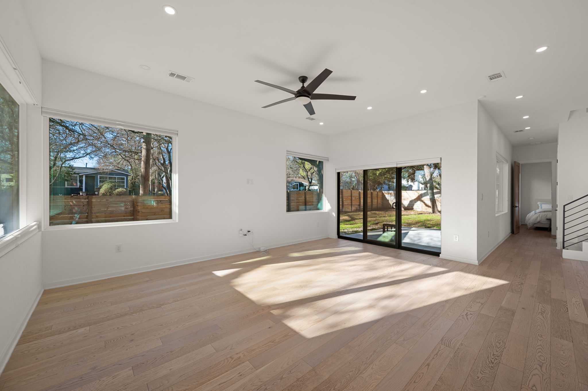 910 Nalide Street, Unit B Austin, TX 78745 - Photo 6 of 38 a view of an empty room with a window and kitchen view