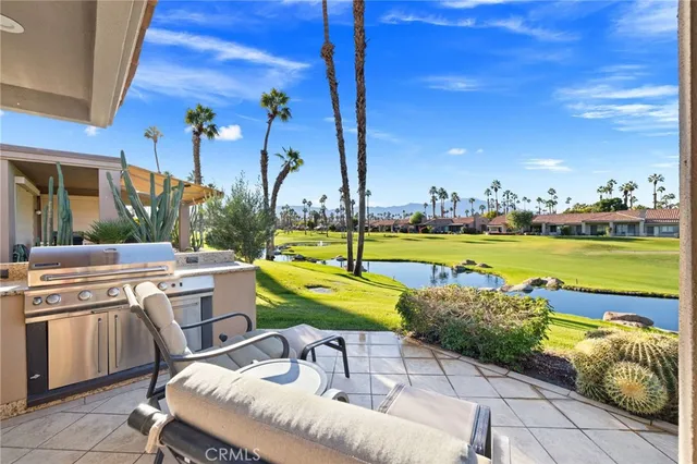 a view of a swimming pool with a table and chairs