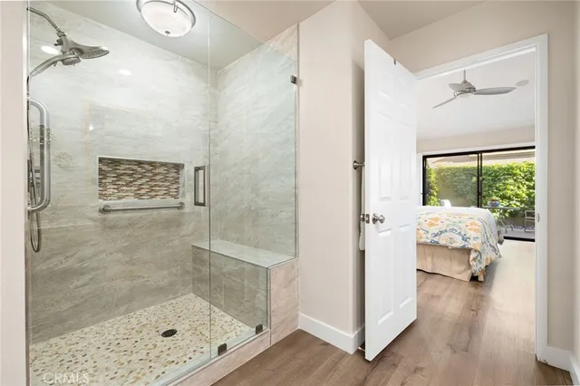 a bathroom with a glass shower door