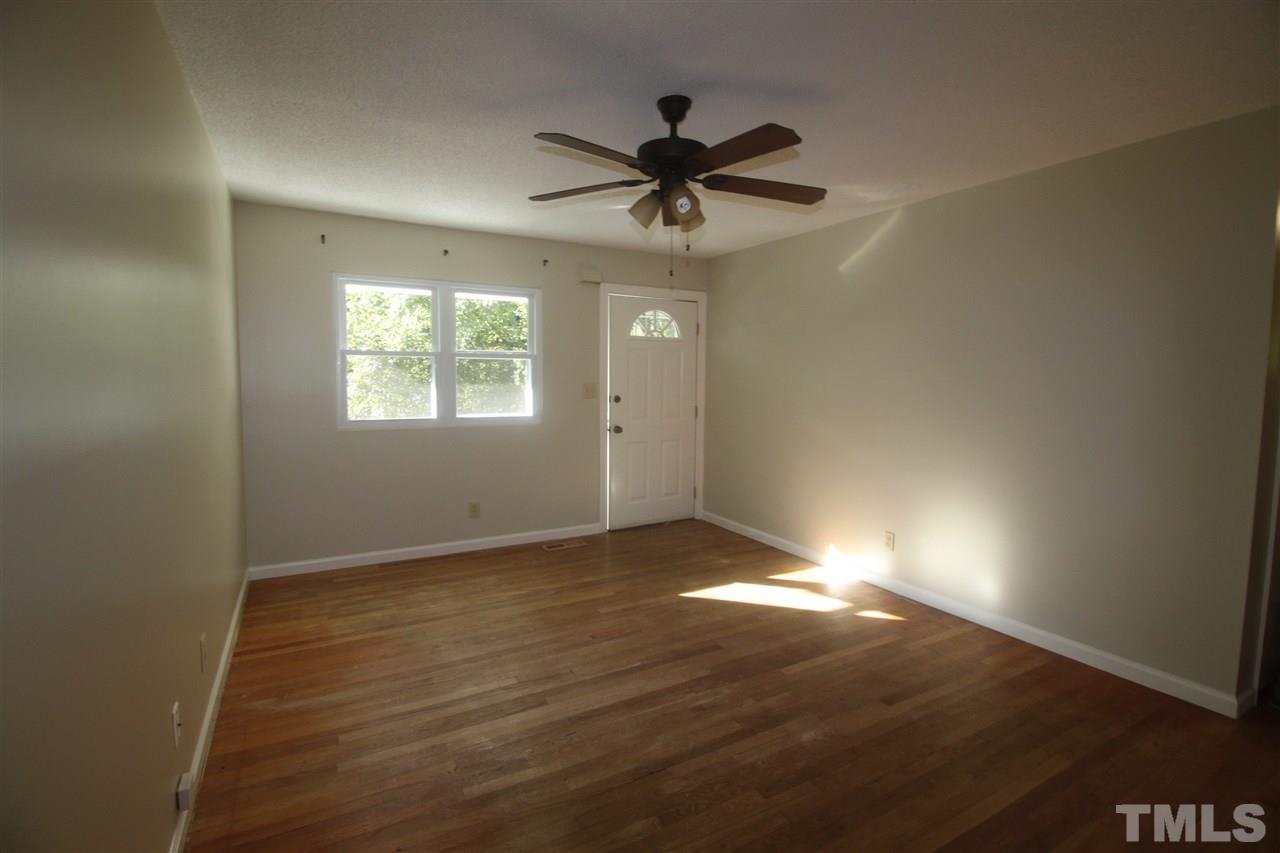 1409 Kelly Road Garner, NC 27529 - Photo 2 of 20 a view of an empty room and window