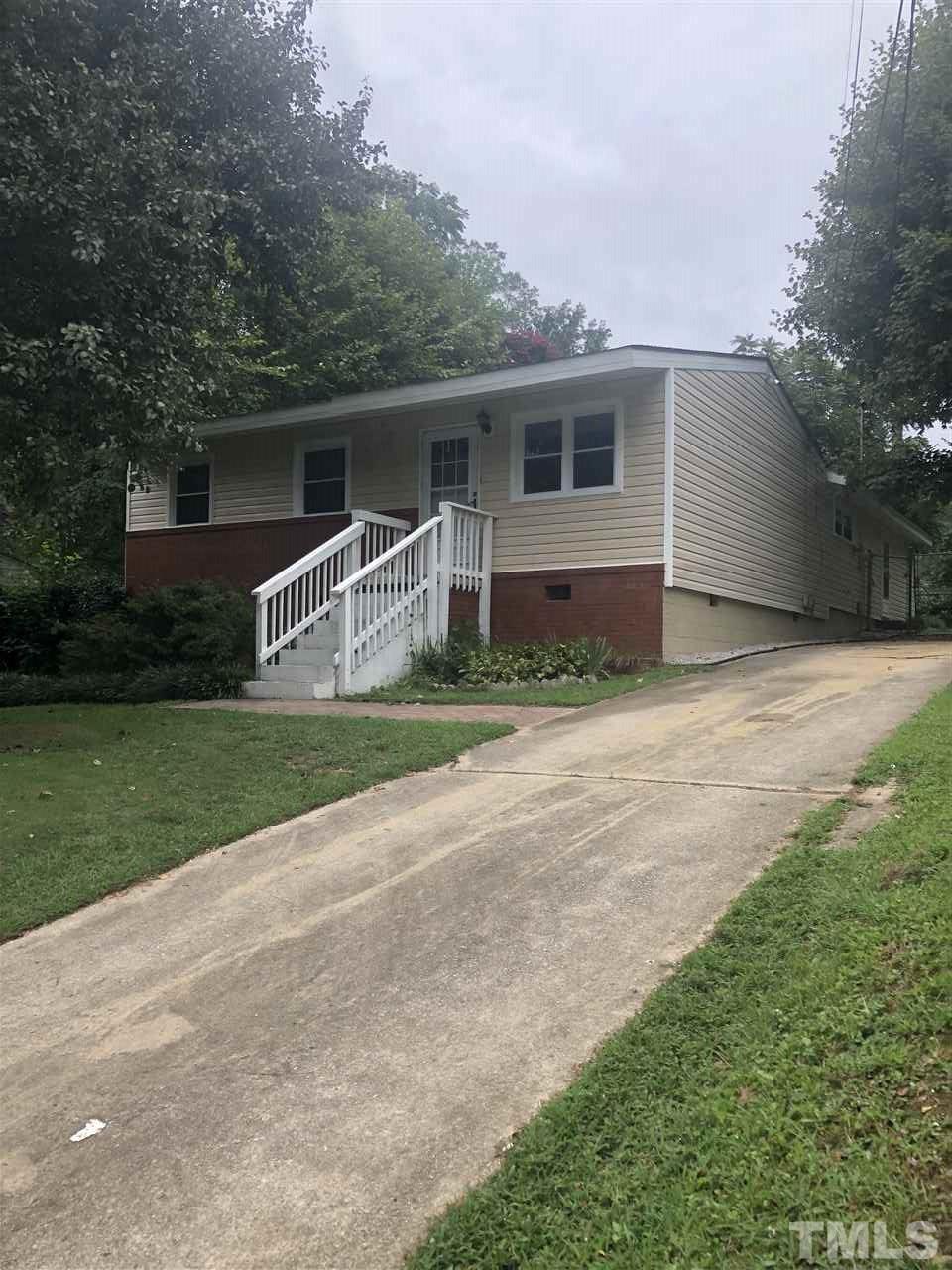 1409 Kelly Road Garner, NC 27529 - Photo 19 of 20 a view of a house with back yard