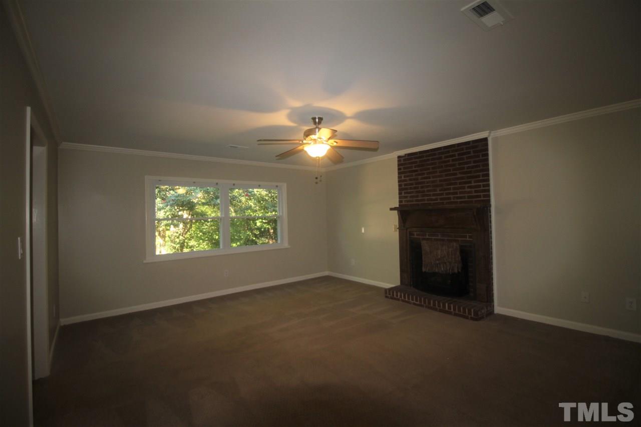 1409 Kelly Road Garner, NC 27529 - Photo 7 of 20 a view of an empty room with a window