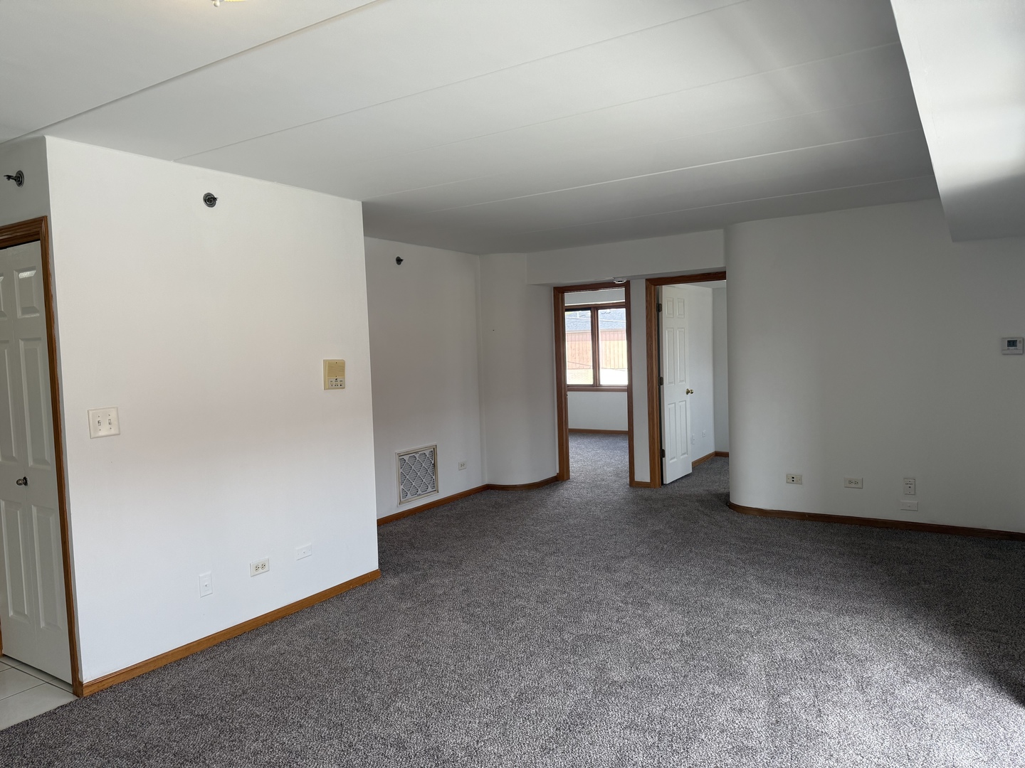 5627 107th Street, Unit 2E Chicago Ridge, IL 60415 - Photo 3 of 9 an empty room with windows