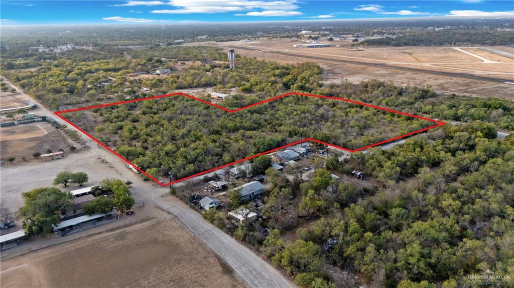 1706 East Ashley Road San Antonio, TX 78214 - Photo 10 of 16 Expansive undeveloped land parcel outlined in red, featuring significant tree coverage