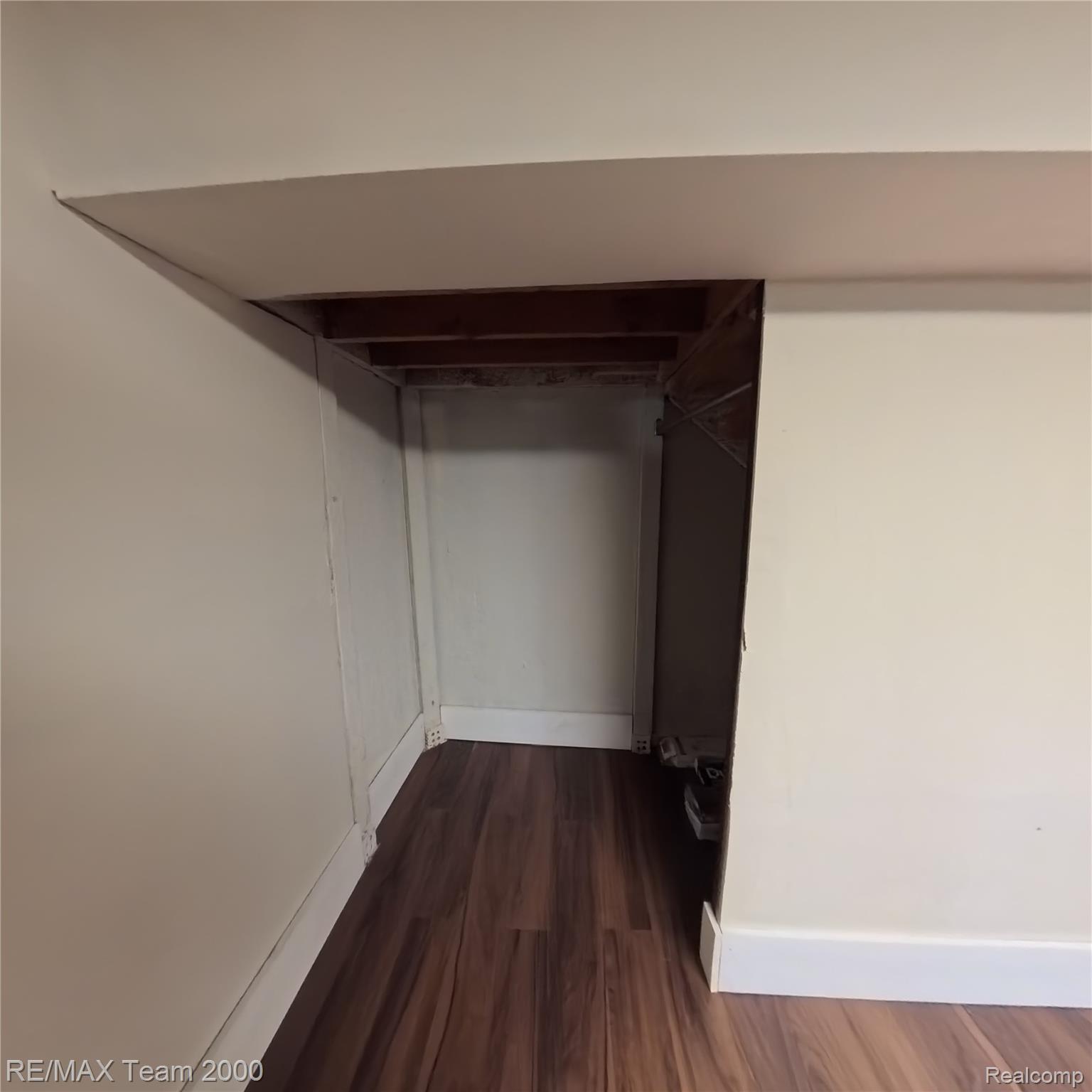 2104 Whittier Road Ypsilanti, MI 48197 - Photo 37 of 45 Walk in closet with dark wood-style floors