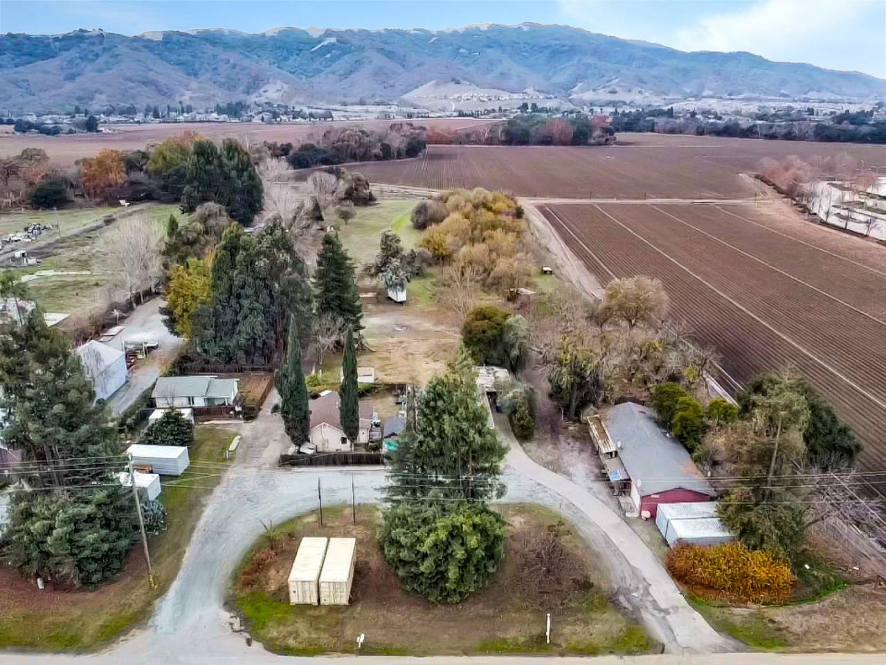 an aerial view of a houses with a lake view