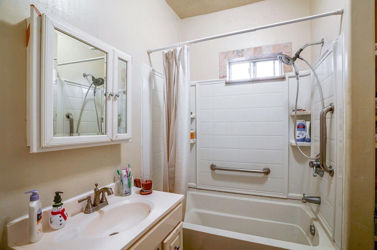5885 Monterey Frontage Road, Unit A Gilroy, CA 95020 - Photo 14 of 49 a bathroom with a sink and a bathtub