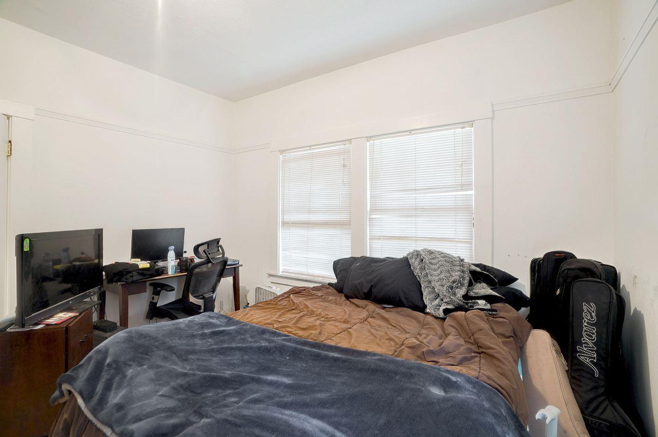 5885 Monterey Frontage Road, Unit A Gilroy, CA 95020 - Photo 15 of 49 a bedroom with a bed and a window