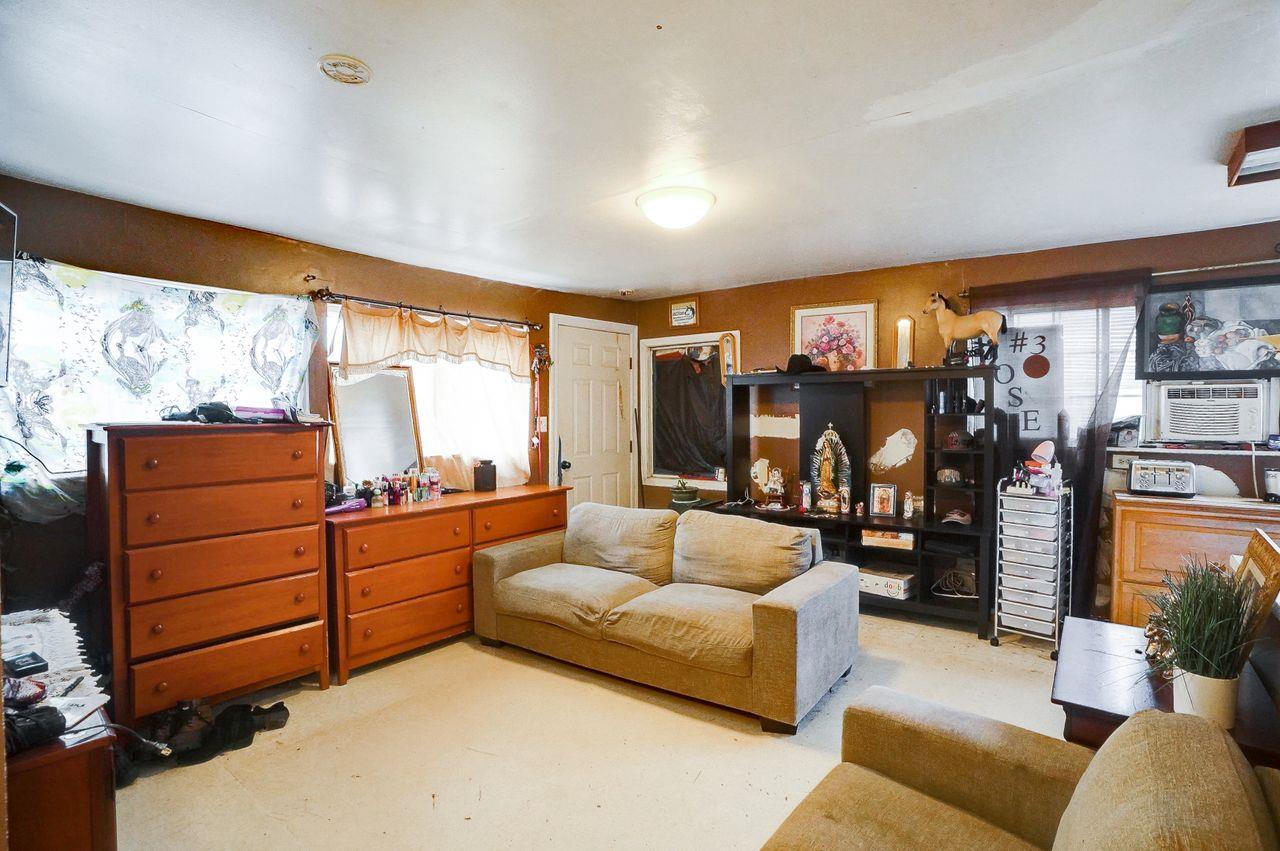 5885 Monterey Frontage Road, Unit A Gilroy, CA 95020 - Photo 23 of 49 a living room with furniture cabinets and a large window
