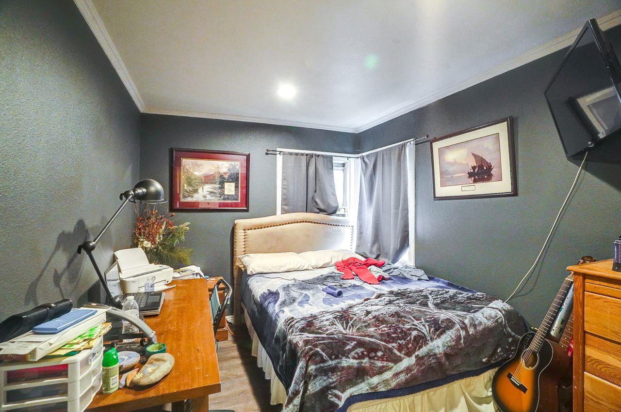 5885 Monterey Frontage Road, Unit A Gilroy, CA 95020 - Photo 25 of 49 a bed room with a bed and a chair