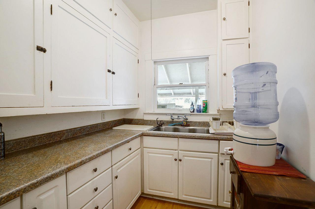 5885 Monterey Frontage Road, Unit A Gilroy, CA 95020 - Photo 8 of 49 a kitchen with a sink stove and cabinets