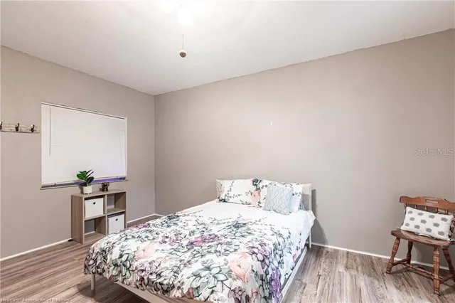 a bedroom with a bed and a table in it