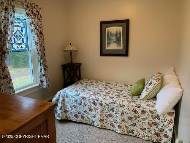 1164 Upper Seese Hill Road Canadensis, PA 18325 - Photo 7 of 12 a bedroom with a bed and a table in it