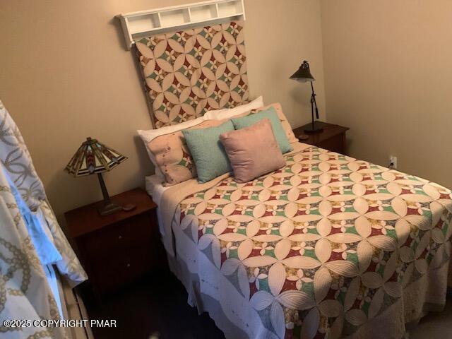 1164 Upper Seese Hill Road Canadensis, PA 18325 - Photo 8 of 12 a bed sitting in a bedroom next to a lamp