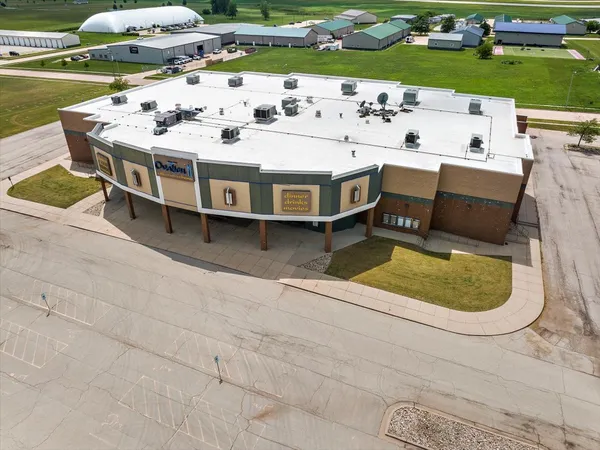 a white swimming pool with a garden and plants